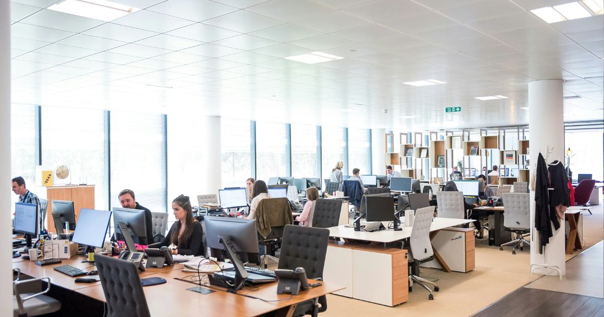 Office environment with employees working on computers